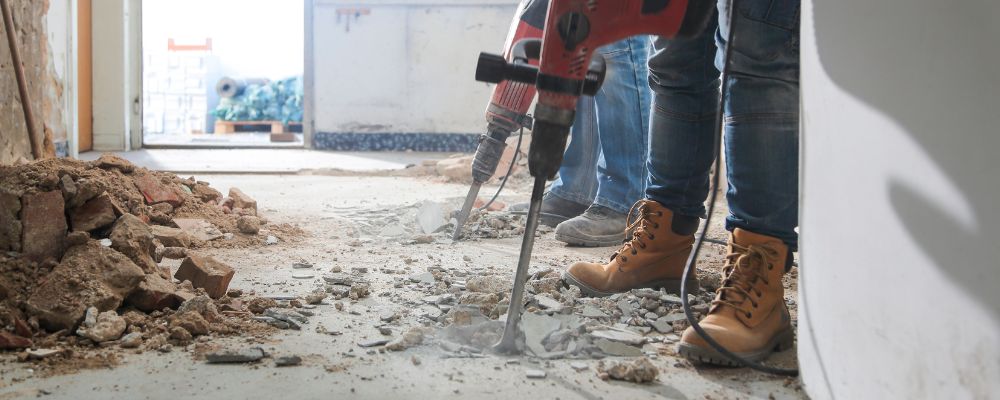 Home renovation workers creating dust and damage