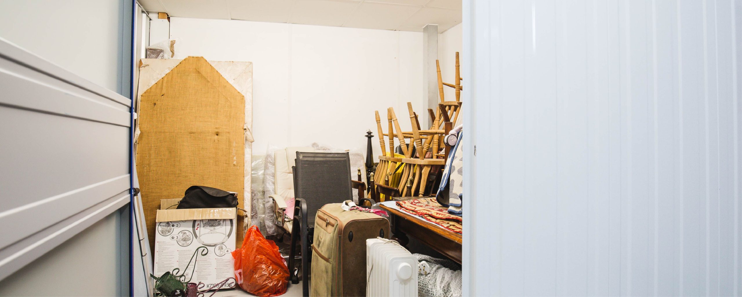 A homeowner safely stores items from their bedroom in a Wigwam self storage unit.