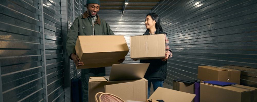 people-packing-winter-gear-into-a-storage-unit